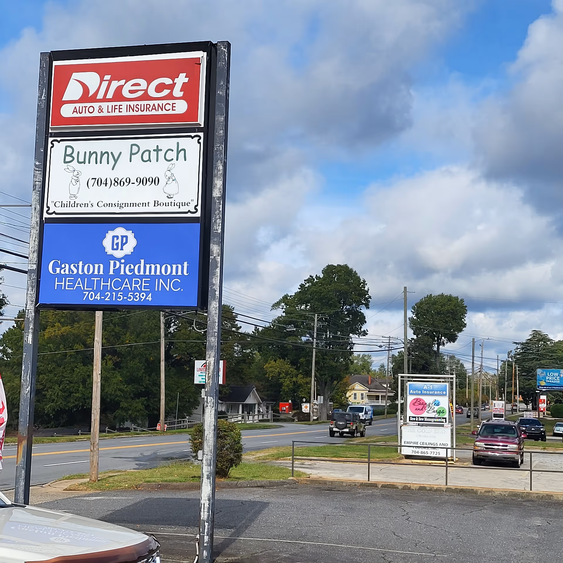 Tall outdoor sign with Direct Auto & Life Insurance and Gaston Piedmont Health Care Inc.
