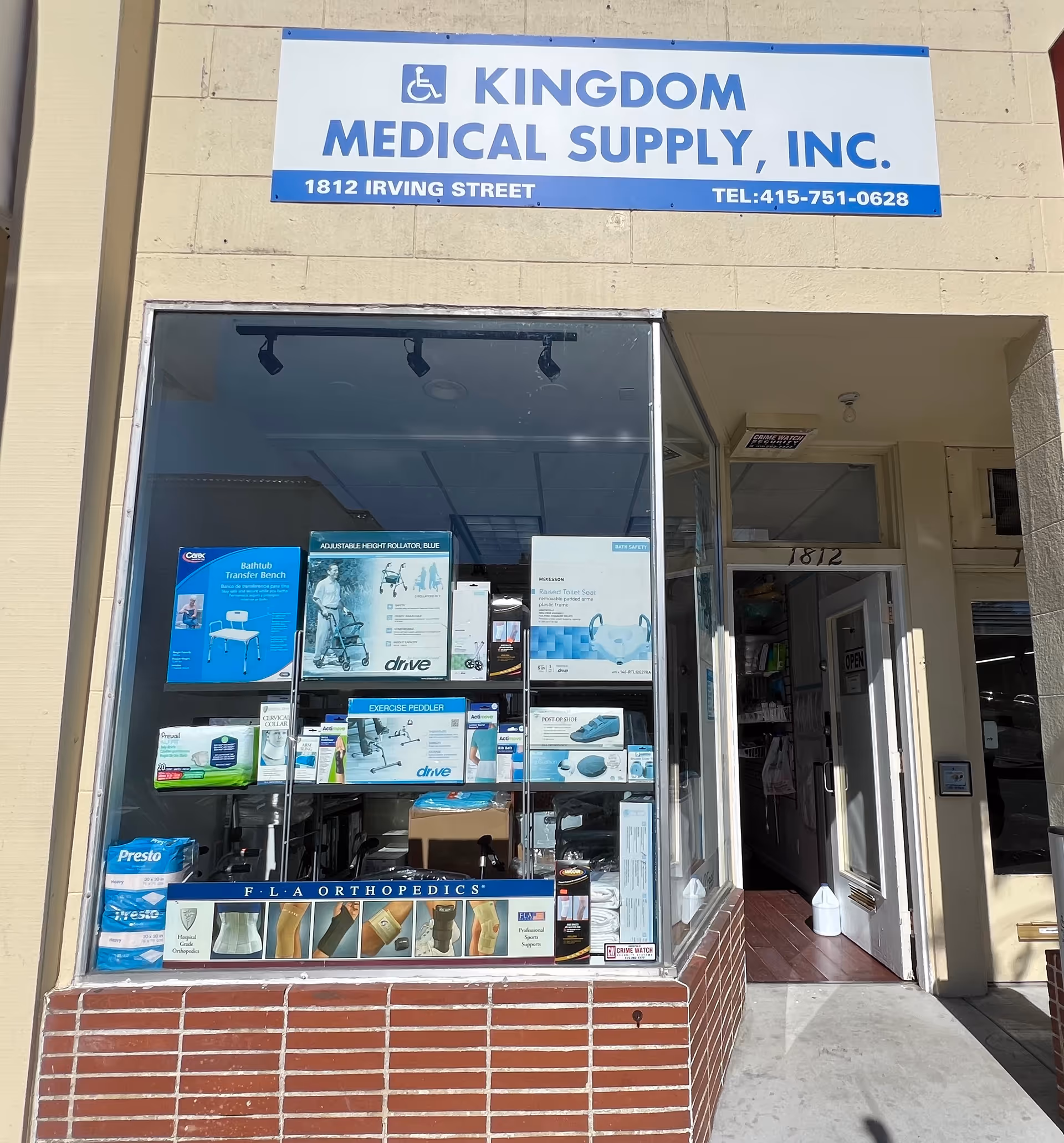 Storefront sign Kingdom Medical Supply, Inc. with window displays of medical equipment.
