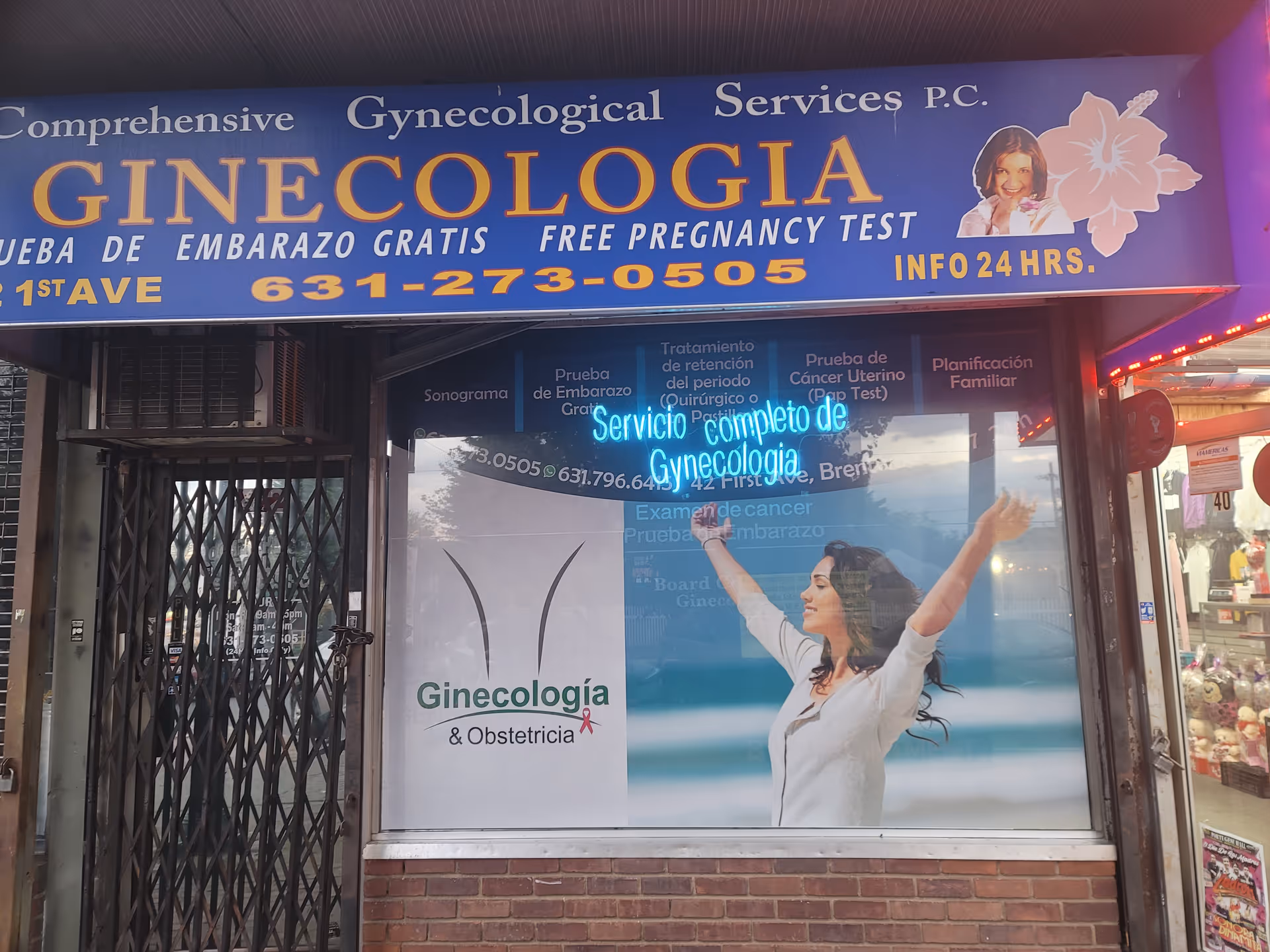 Blue storefront with large yellow 'GINECOLOGÍA' lettering advertising gynecology services.