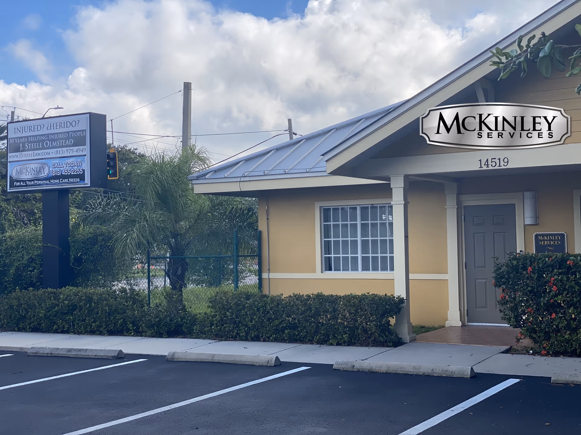 Yellow single-story facility with McKinley Services sign, front entrance, and adjacent parking lot.