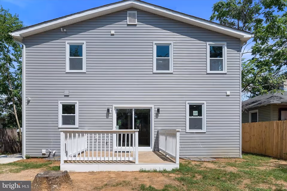 Exterior view of a two-story senior living facility with a porch.