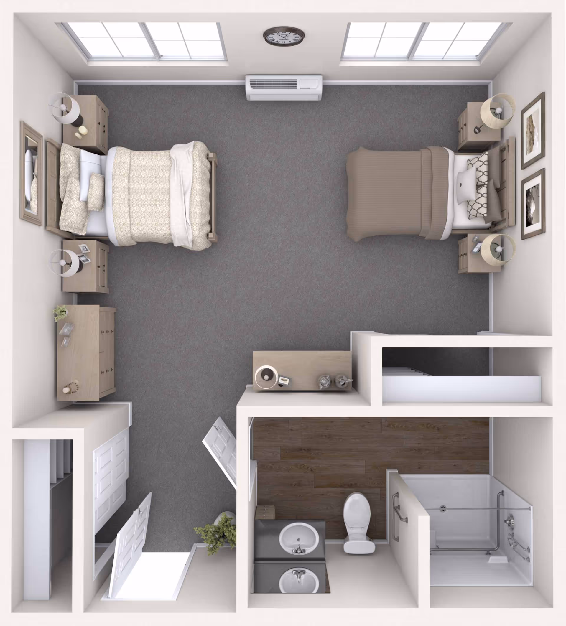 Top-down view of a memory care community room with two beds, each with nightstands and lamps. The room has two large windows, a clock on the wall, a dresser, and a small table. There is an attached bathroom with a toilet, sink, and walk-in shower with grab bars.