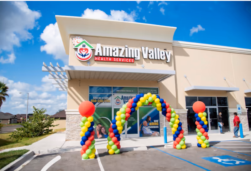 Exterior view of Amazing Valley Health Services with a colorful balloon arch at the entrance.