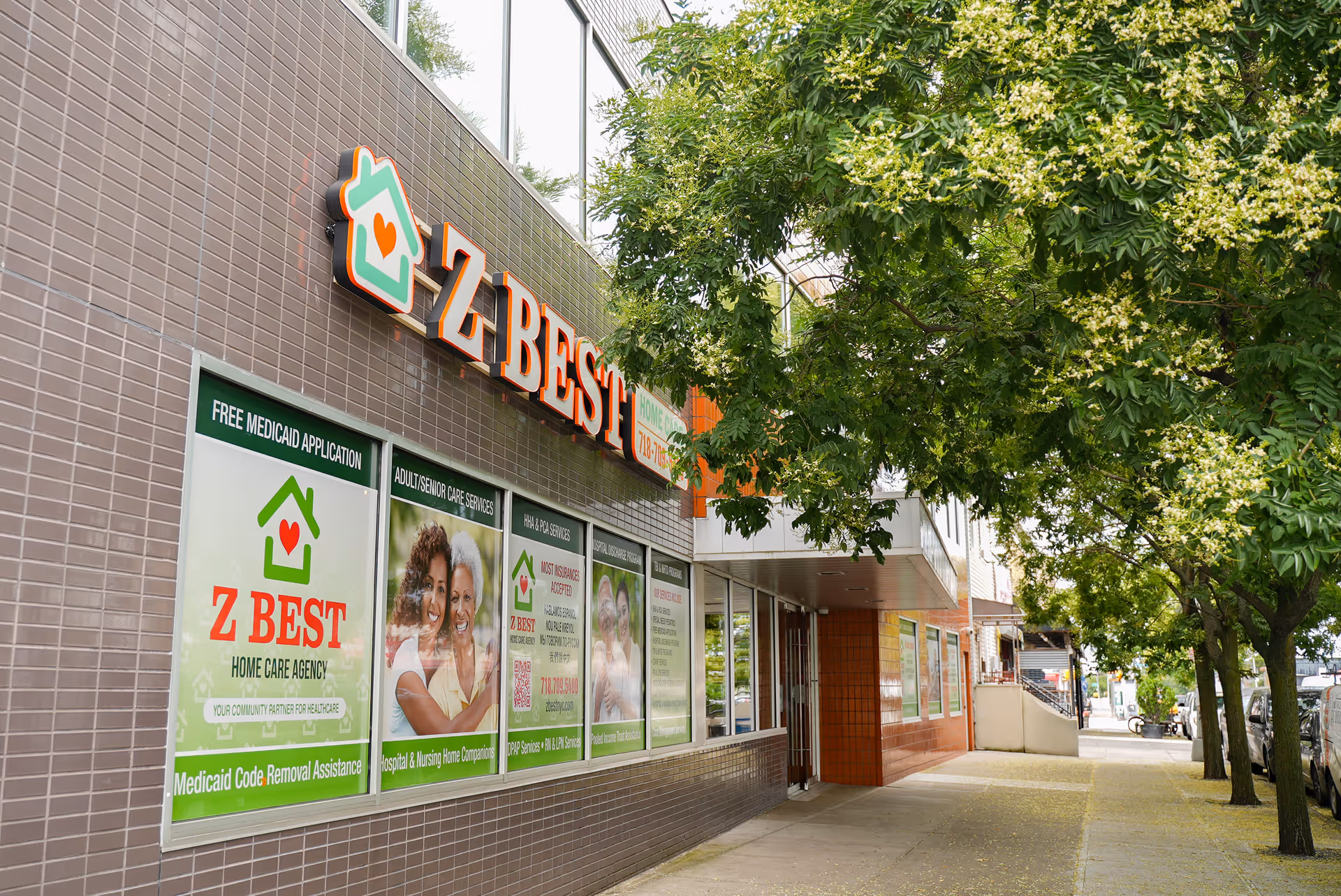 Exterior view of Z Best Home Care storefront with large sign and windows.