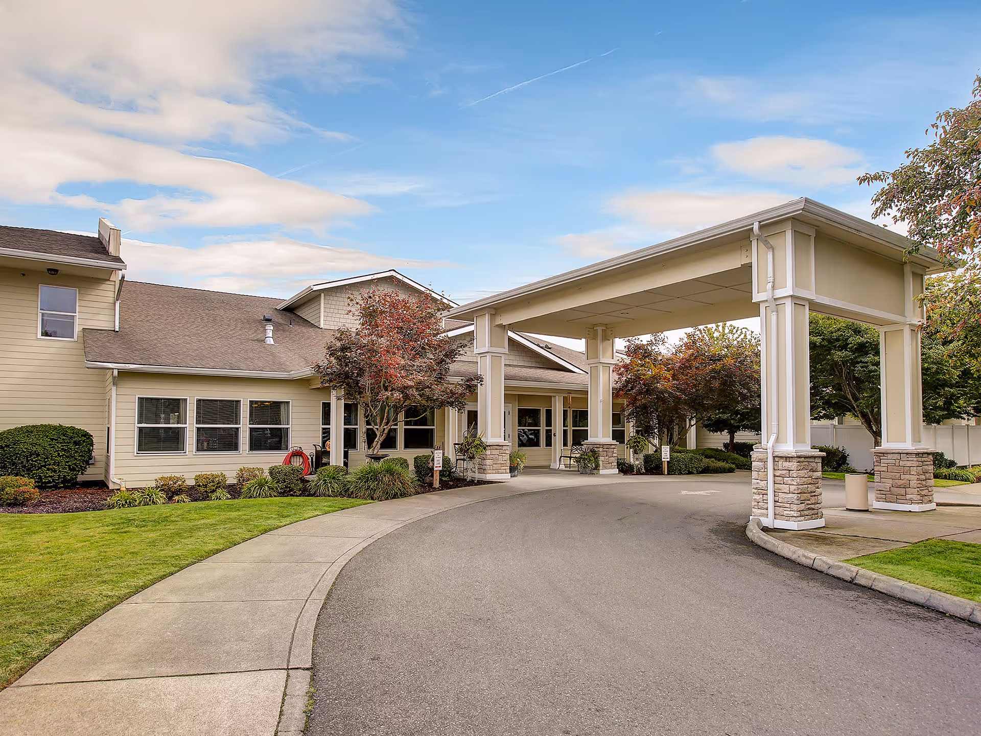 Prestige Senior Living Auburn Meadows front entrance with covered drive and landscaping