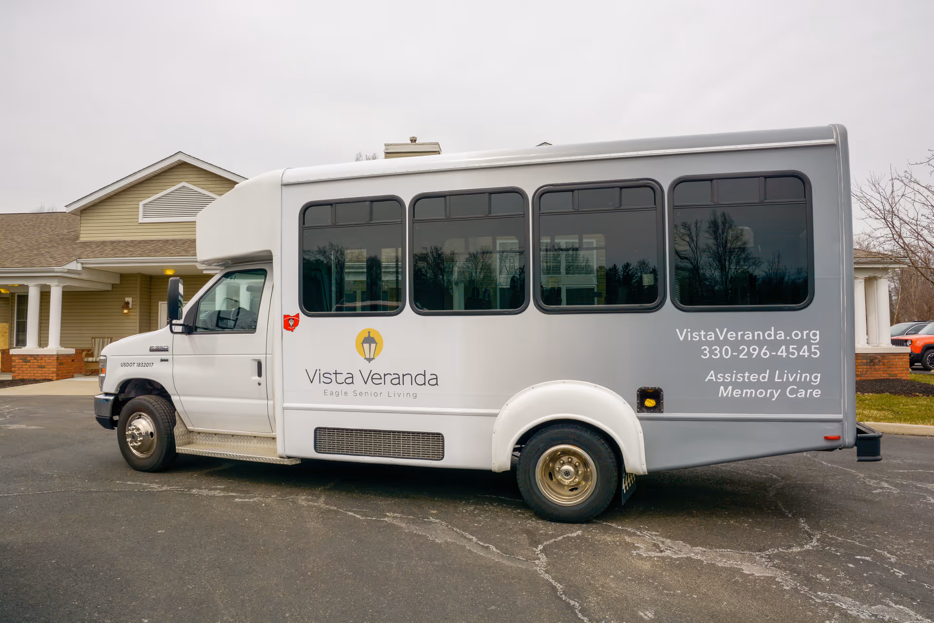 Silver Vista Veranda shuttle bus parked outside a senior living facility.