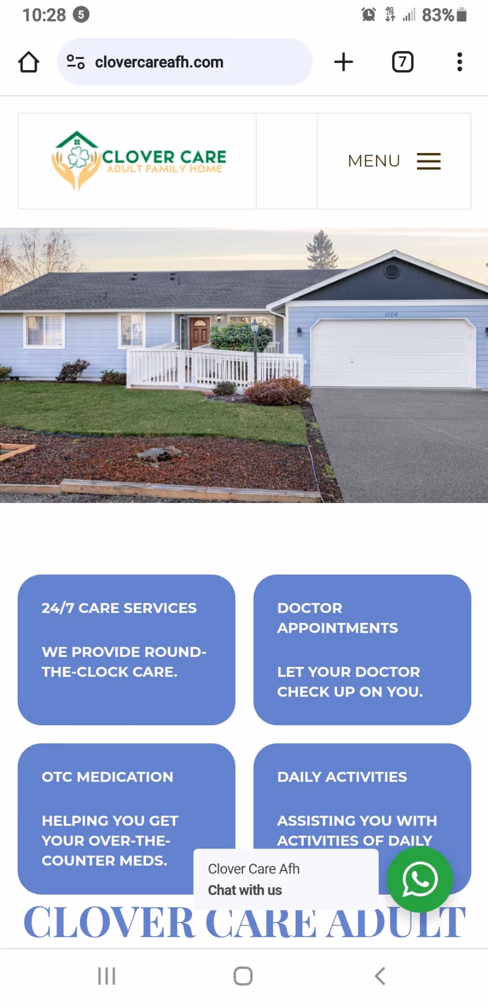 Single-story blue house with a white front porch and two-car garage.
