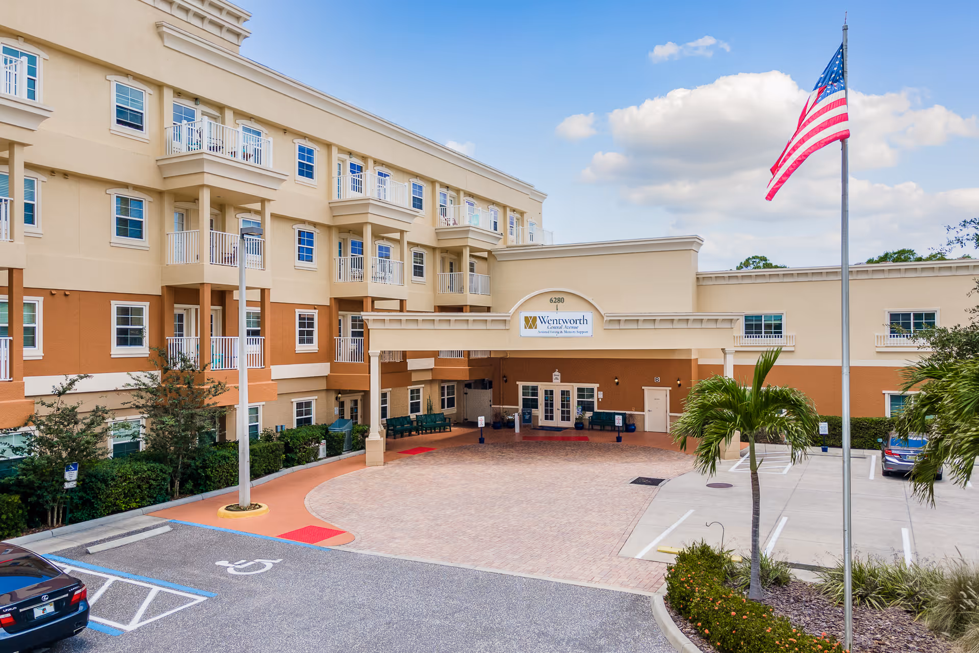 Exterior view of Wentworth Central Avenue entrance with flag and parking area.