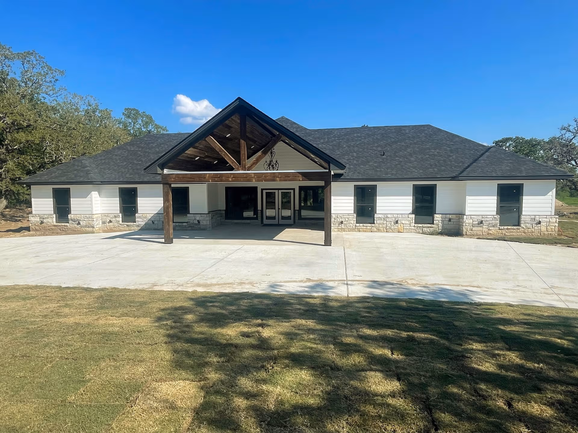Front of Peach Creek Assisted Living facility with covered entrance and stone accents