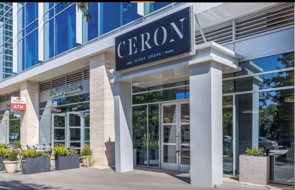 Modern glass-front building exterior with Ceron sign and storefront entrance.