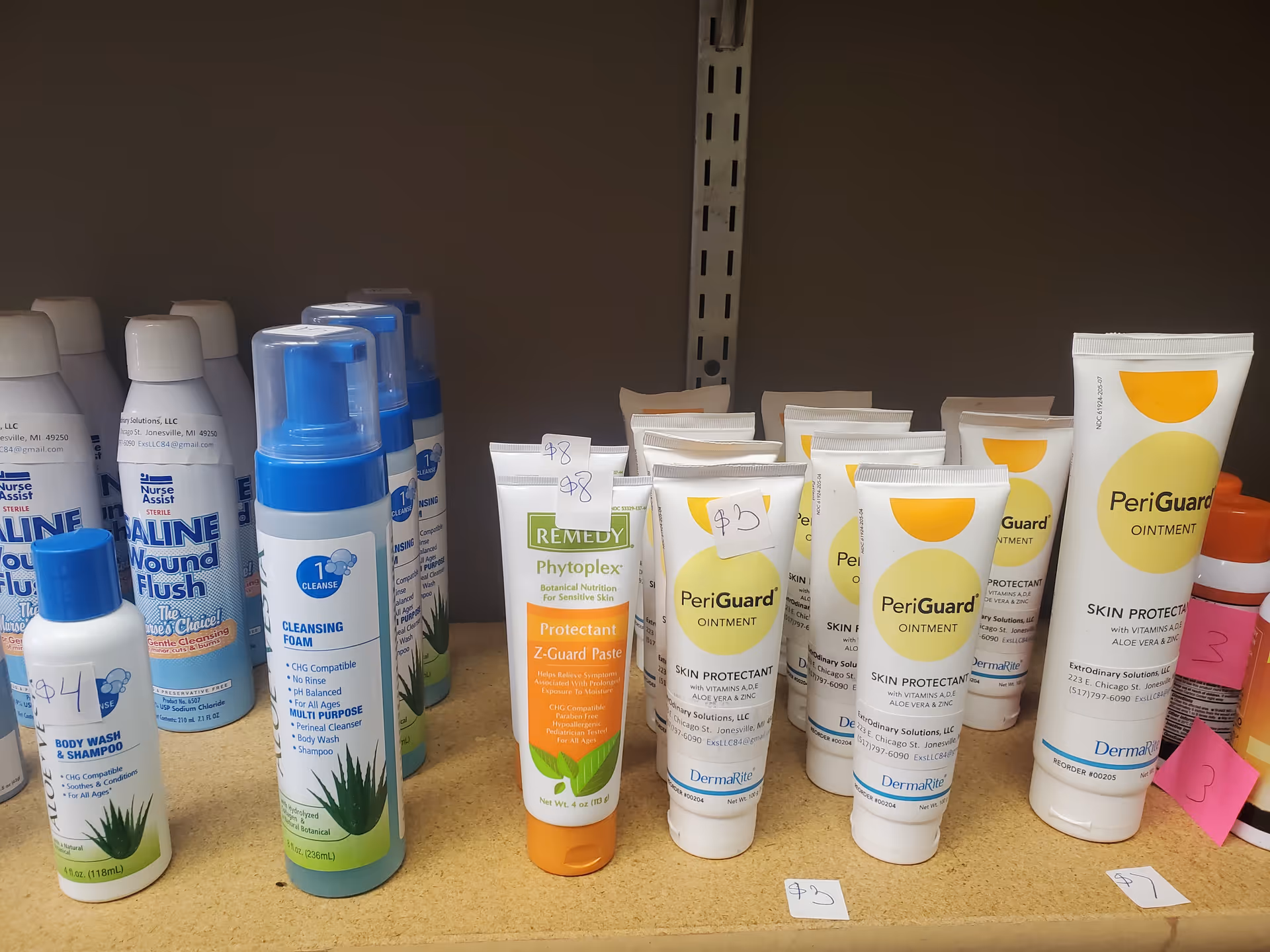 Shelf displaying assorted medical and personal care products in a senior living facility.