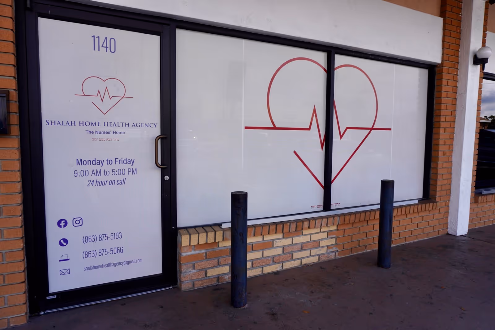 Front view of Shalah Home Health Agency storefront with glass windows and heart logo