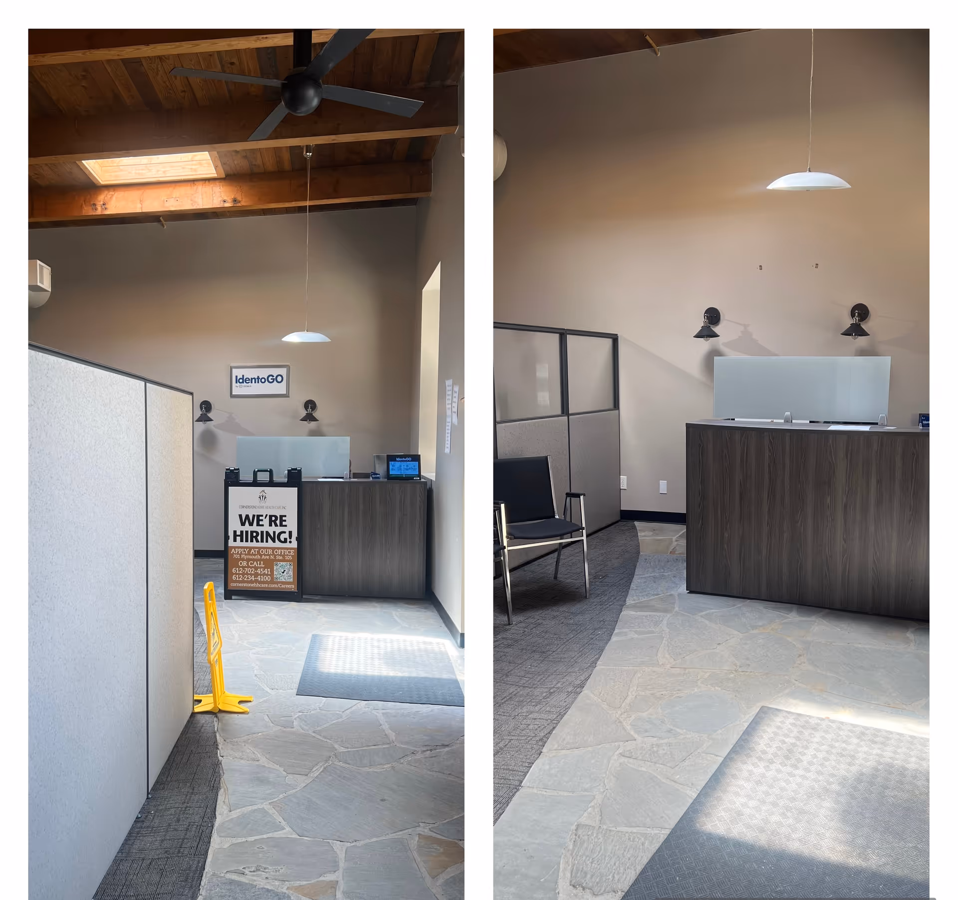 Reception area with a desk, partitions, exposed wooden ceiling, and a hiring sign.
