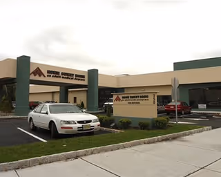 Exterior view of Golden San Andreas Care Center showing parking and signage.