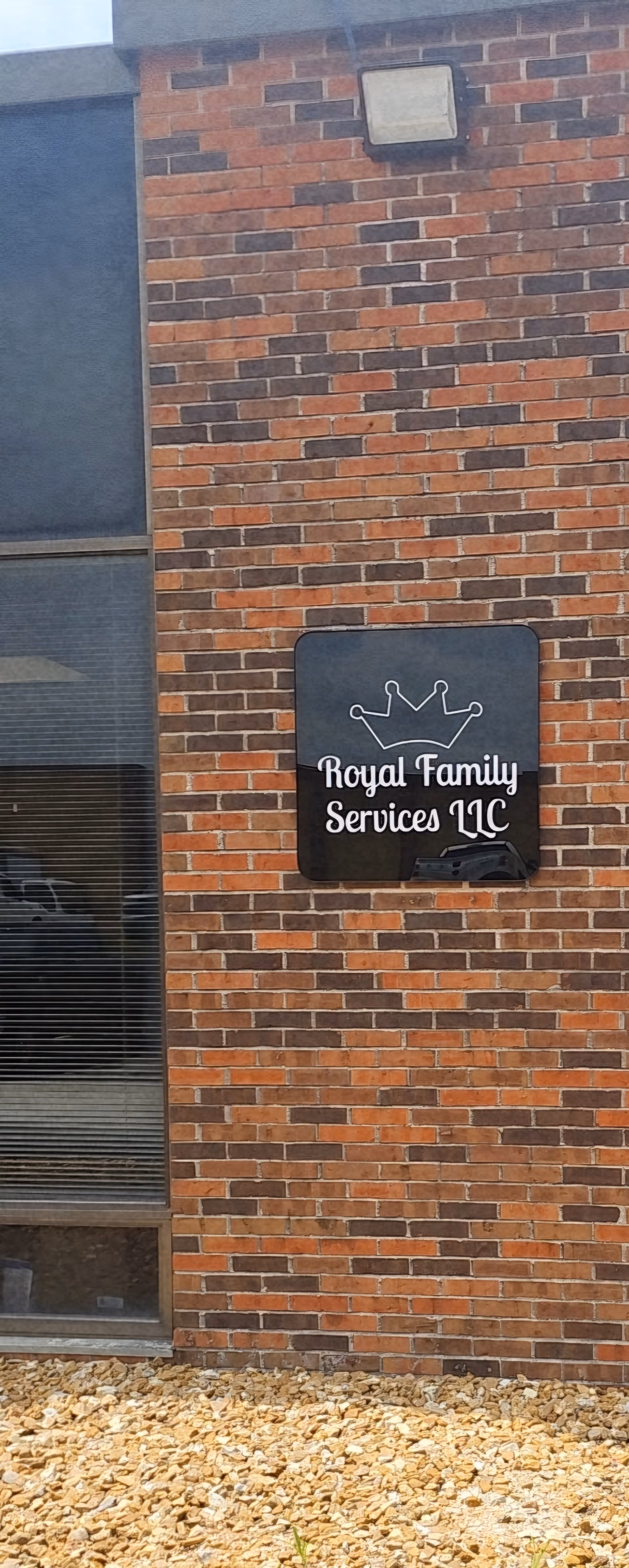 Brick exterior of Royal Family Services LLC with a sign displaying the facility name.