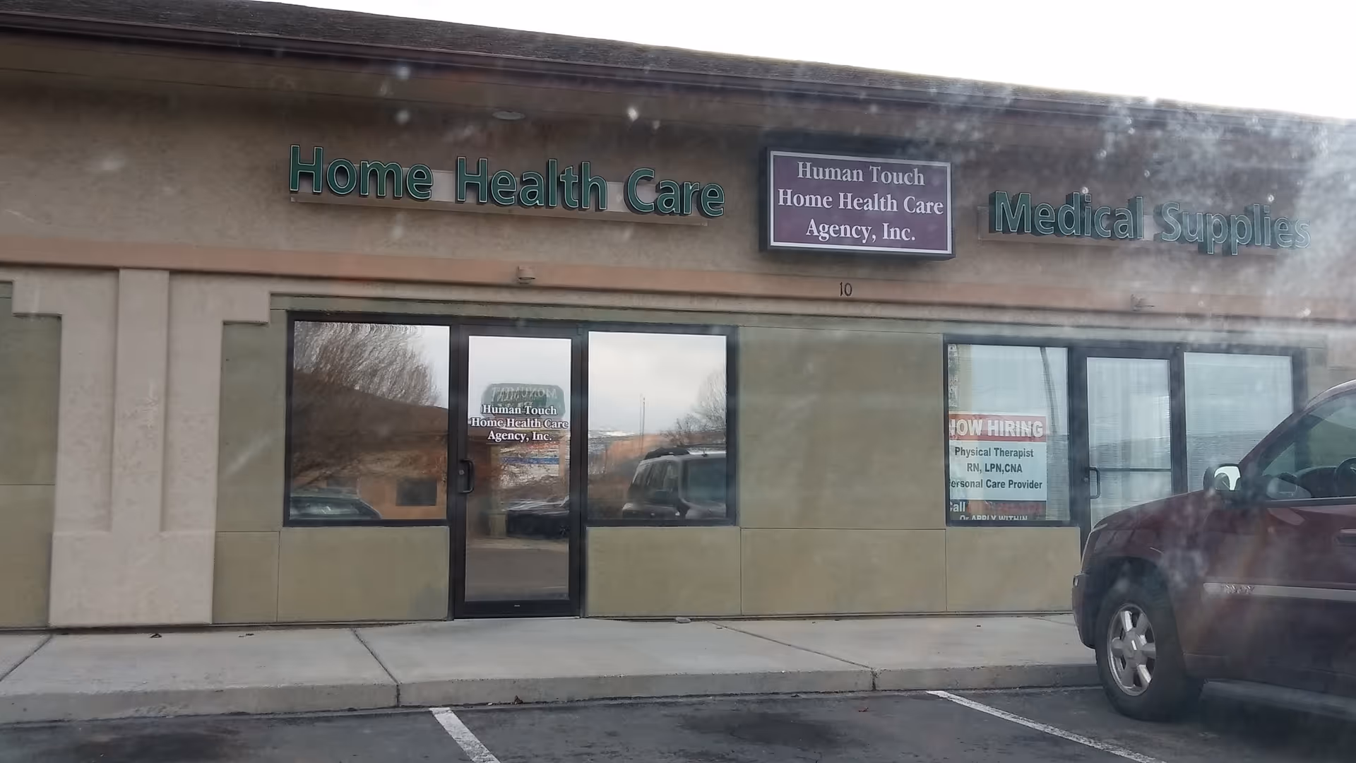 Front view of a storefront with Home Health Care signage and large windows