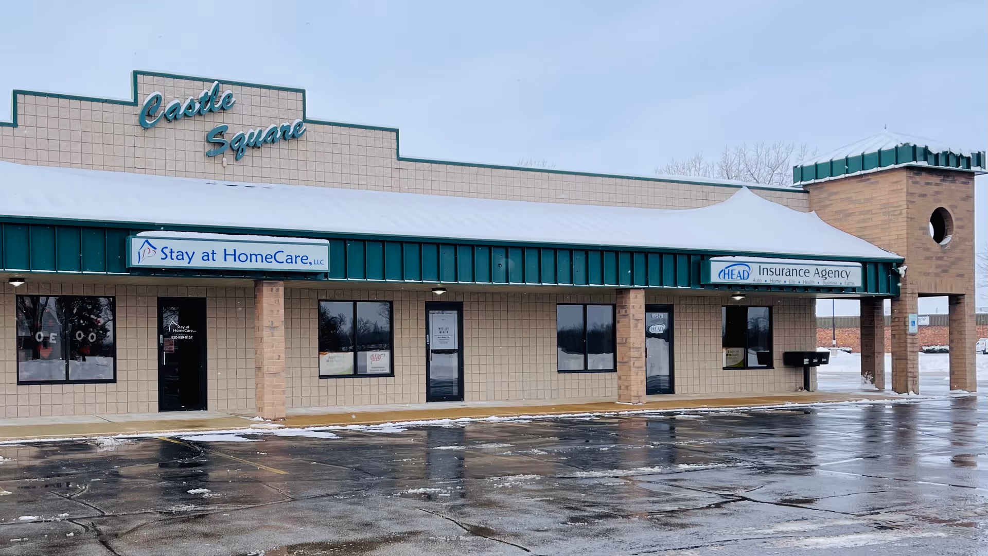 Exterior of Castle Square storefronts with Stay at HomeCare signage