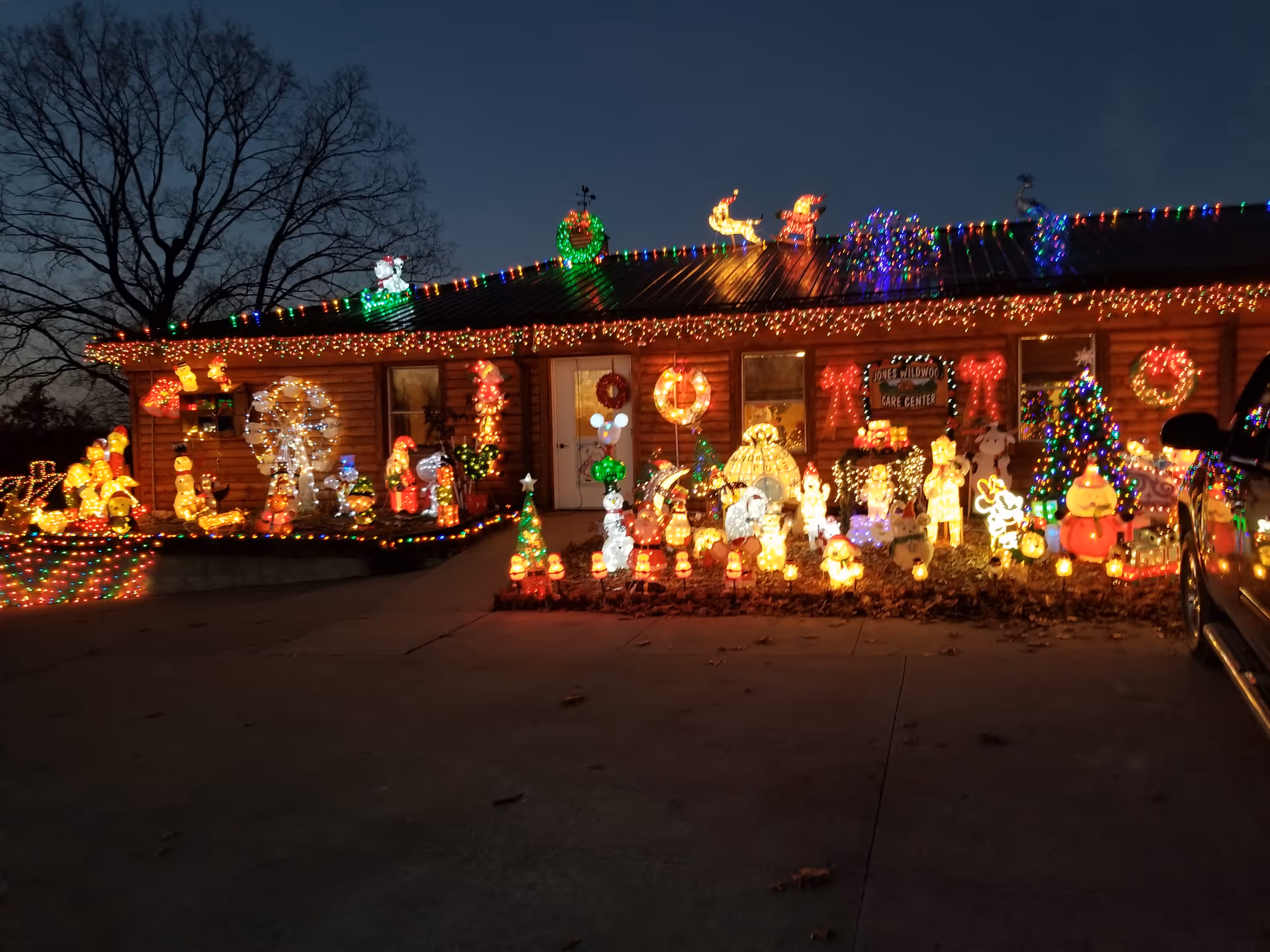 Front view of Jones' Wildwood Care Center adorned with colorful Christmas lights.