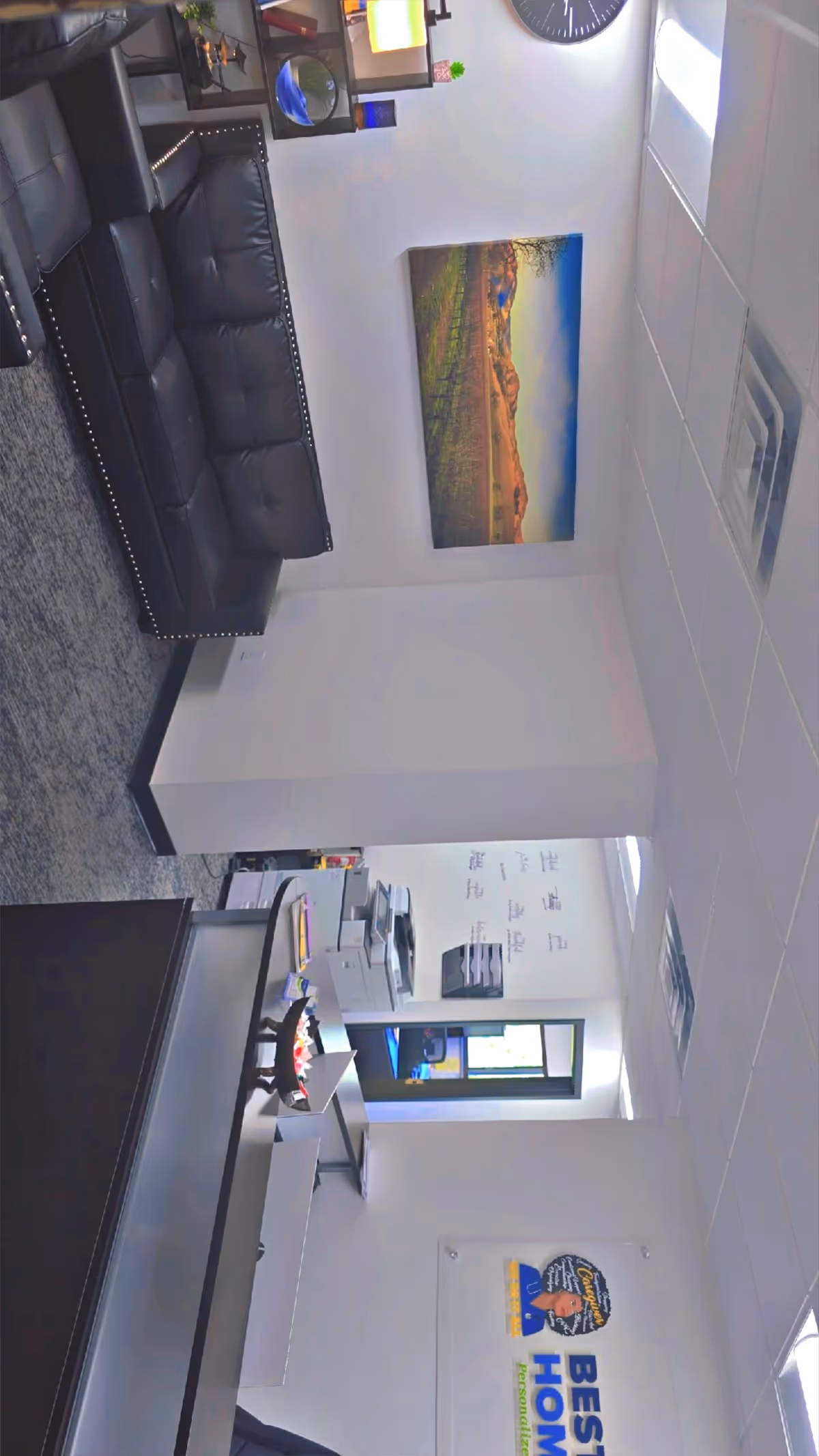 Interior lobby of Best Choice Home Health with leather sofa, reception desk, and wall art.