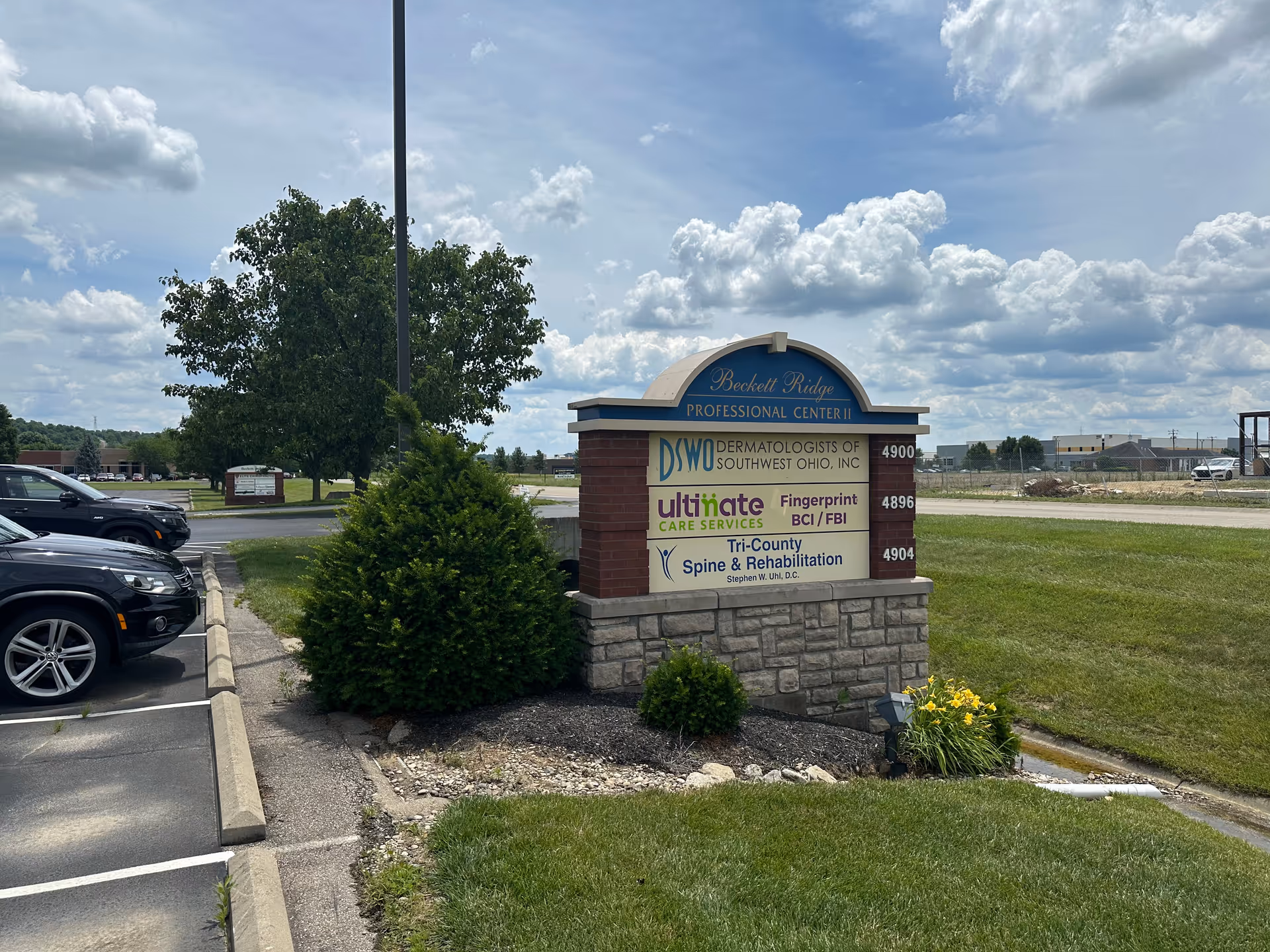 Outdoor sign for Ultimate Care Services at a medical center with parking
