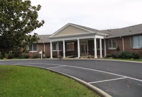 Exterior view of Health Center at Standifer Place with brick facade and covered entrance.