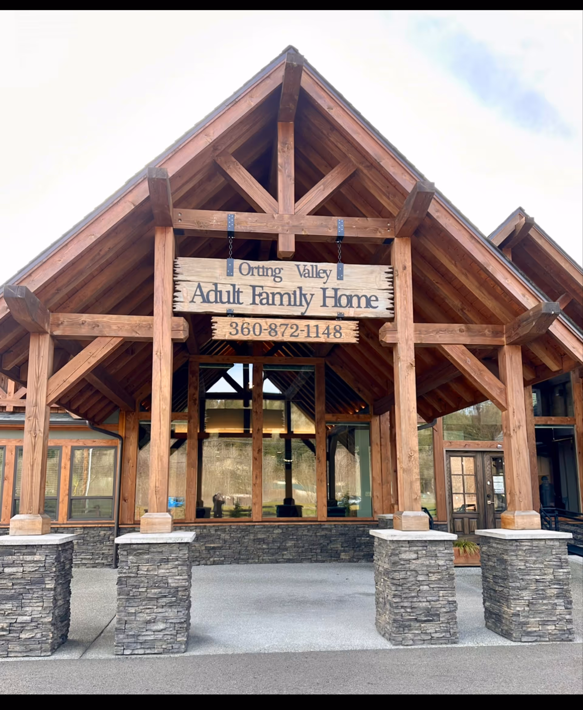 Front entrance of Orting Valley Adult Family Home with wooden beams