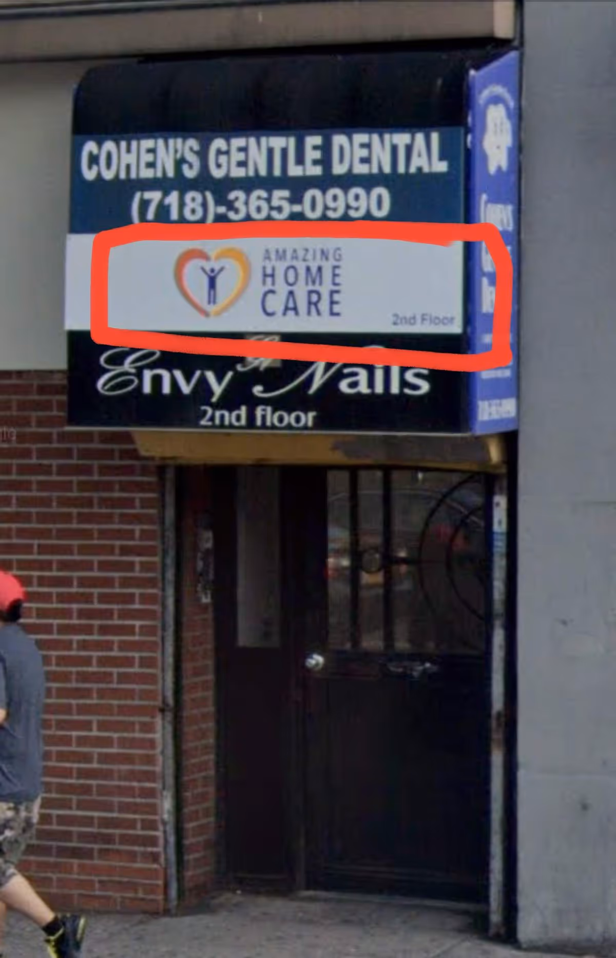 Exterior storefront sign for Amazing Home Care on a brick building.