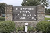 Brick entrance sign reading Friendship Haven Healthcare and Rehabilitation with greenery.