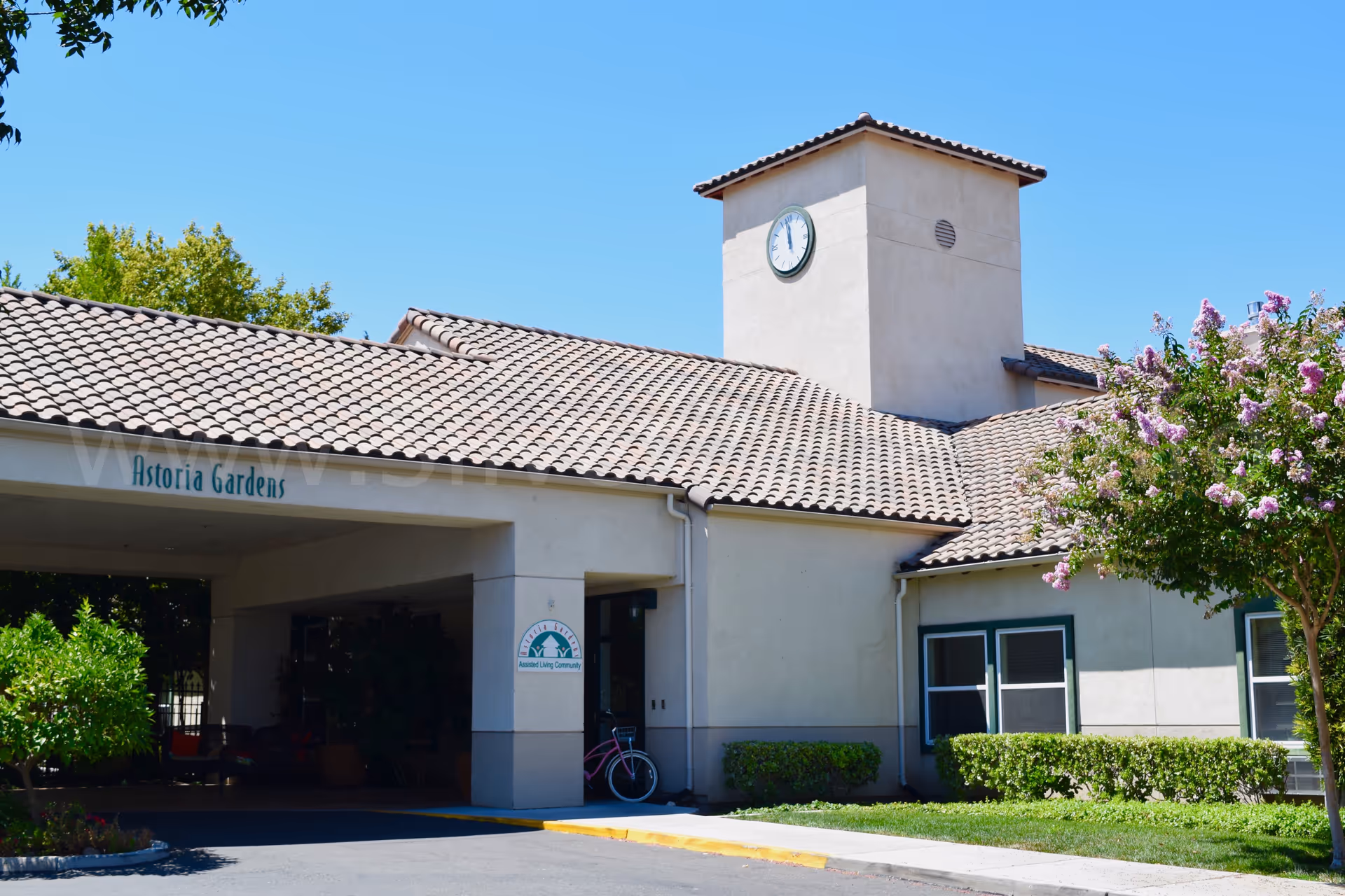 Exterior view of Astoria Senior Living at Tracy with clock tower.