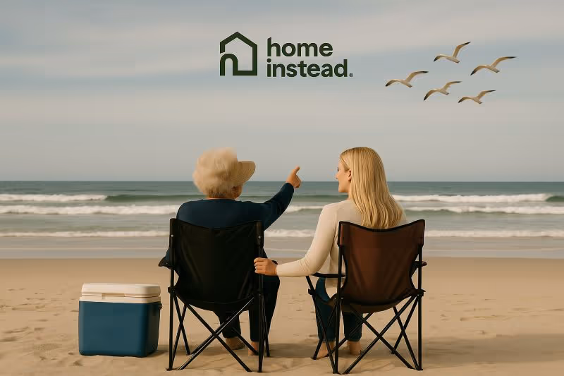 Two people sit in beach chairs by the ocean, with a Home Instead logo above.