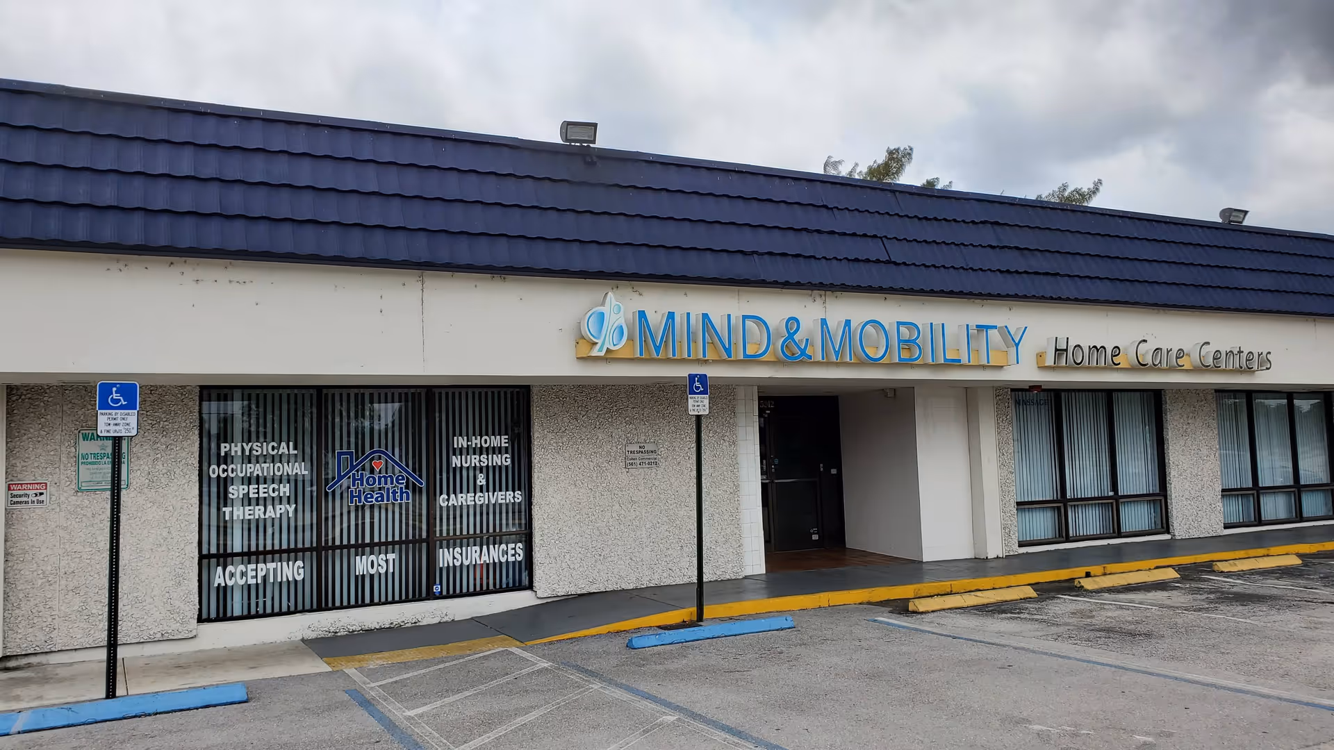 Front exterior of Mind and Mobility Home Care Centers with signage and handicap parking