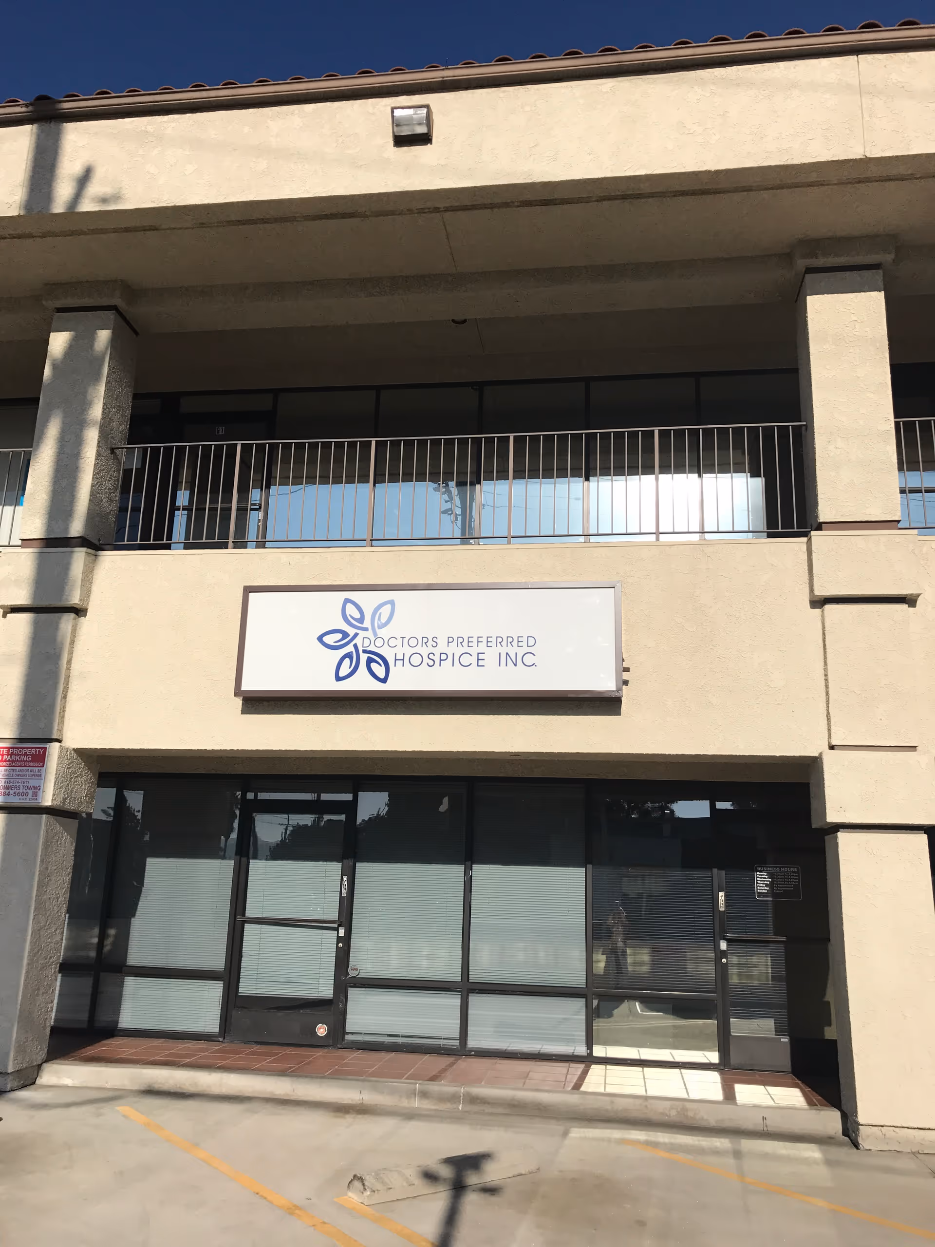 Exterior view of a medical building with a Doctors Preferred Hospice Inc. sign.