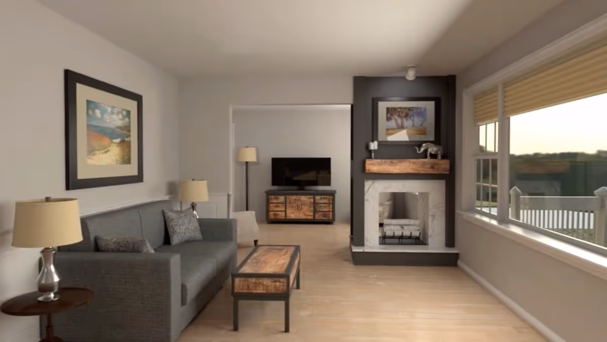 Crestwood Manor living room with sofa, coffee table, fireplace, and a large window view.
