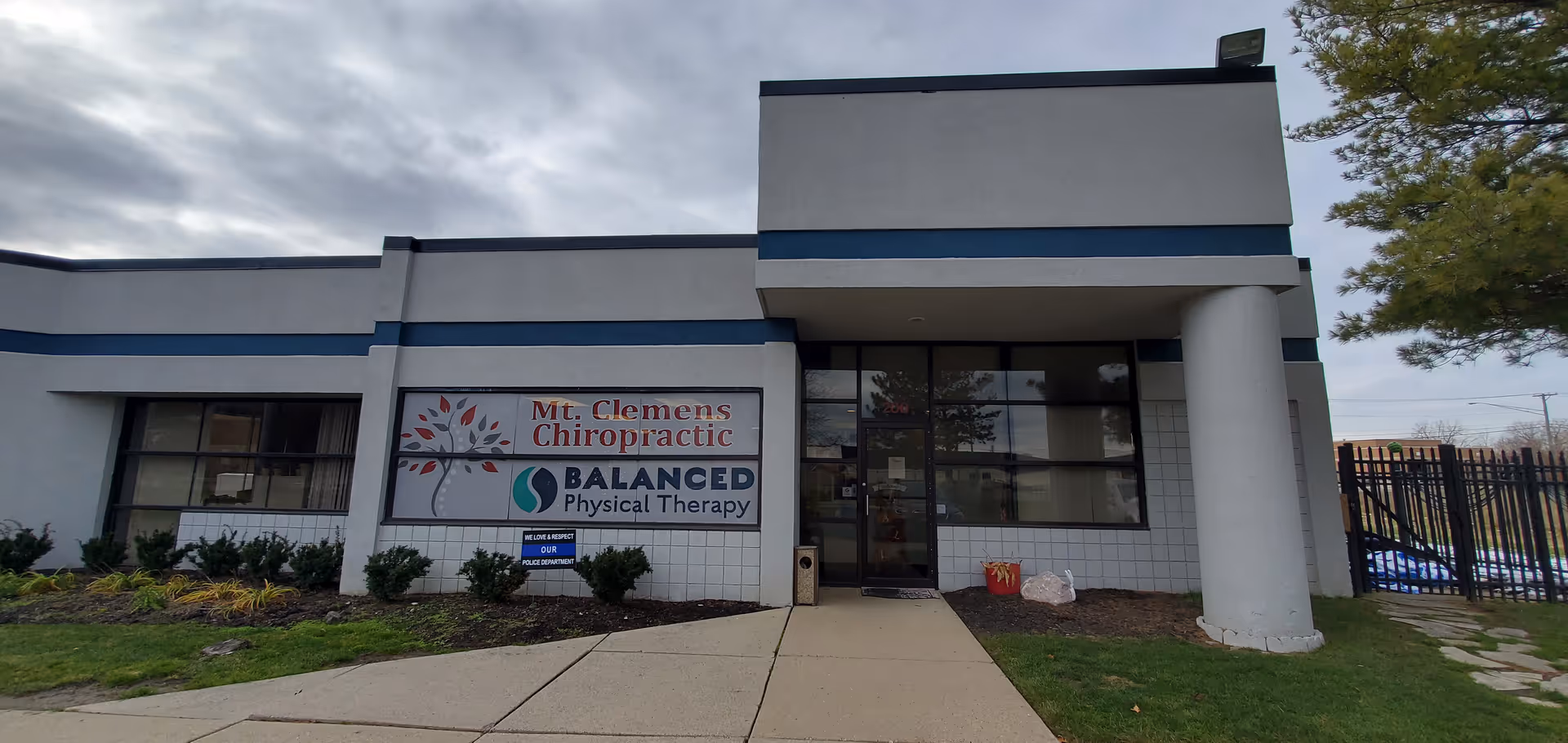 Exterior of a modern clinic with front entrance and Balanced Physical Therapy sign
