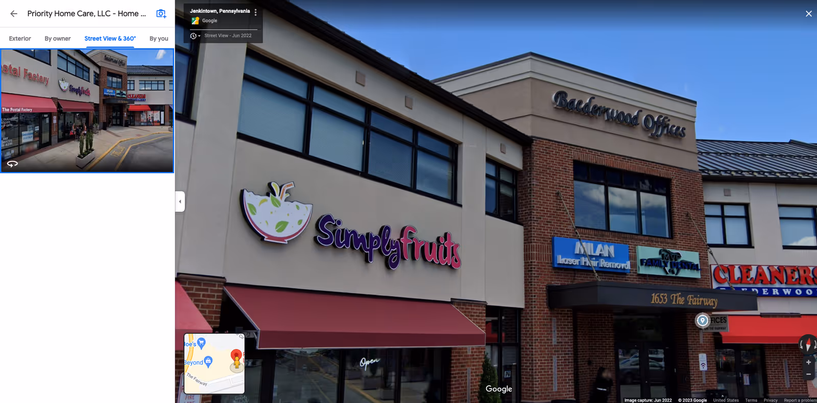 Exterior view of a strip mall storefront with SimplyFruits sign and other shops.