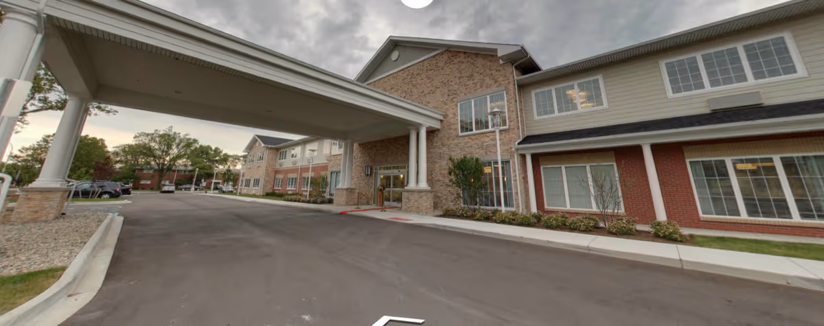 Exterior view of Regency at St. Clair Shores, showing the entrance and canopy over the driveway.