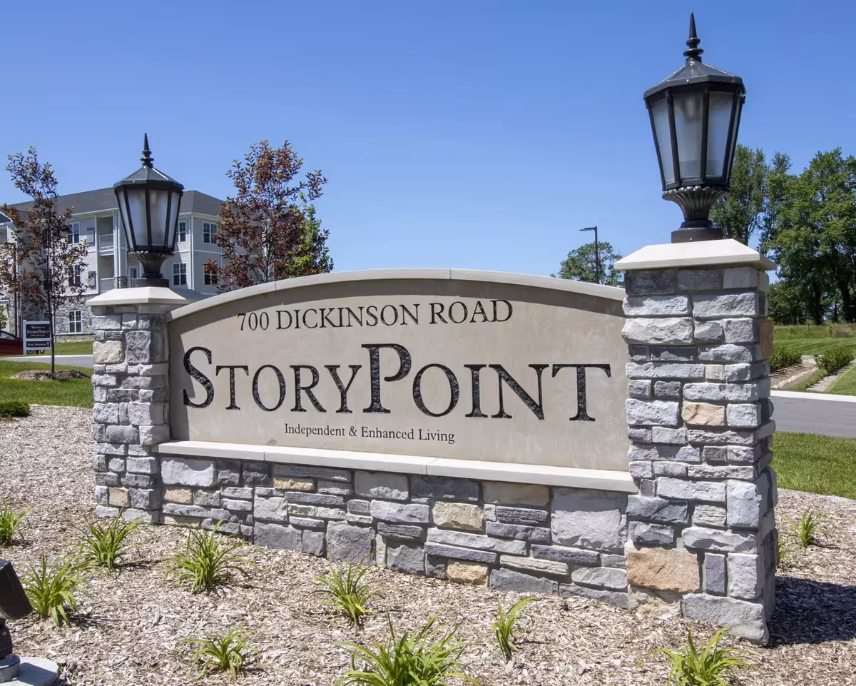 Stone sign reading StoryPoint at the entrance of a senior living community.