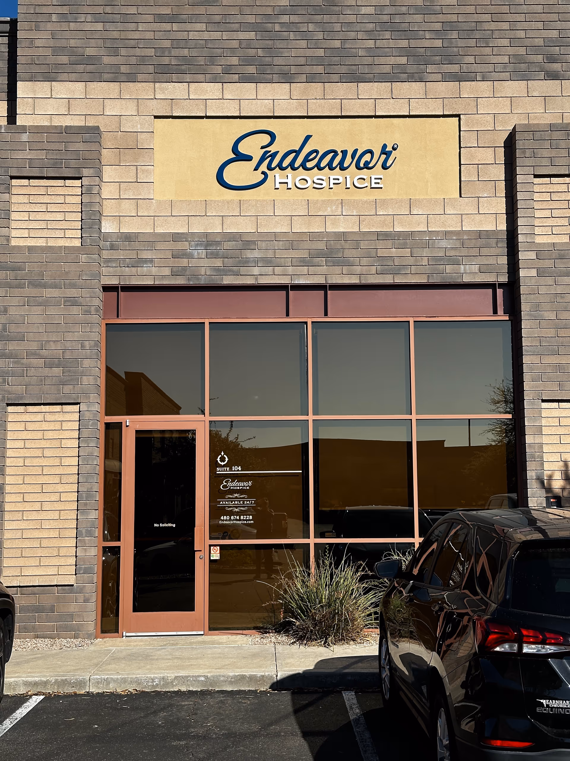 Front of Endeavor Hospice building with glass doors and a prominent sign.