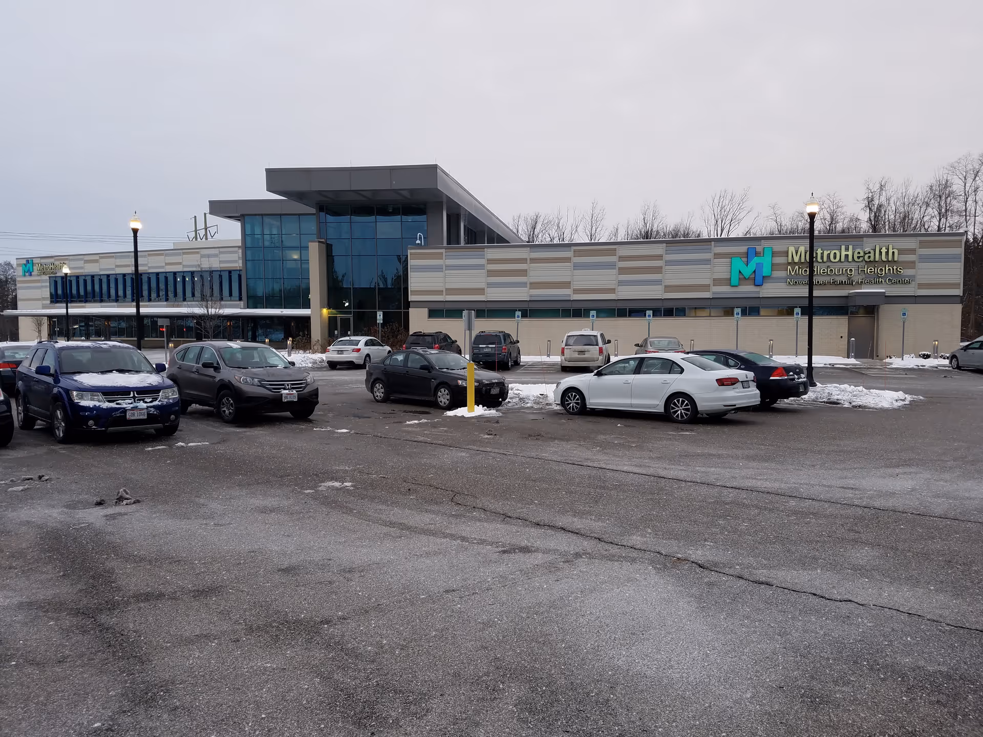 Exterior view of MetroHealth Middleburg Heights Family Health Center with a parking lot.