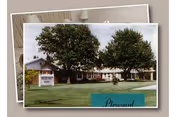 Single-story facility building with a grassy lawn, trees, and a Pleasant View Home sign.