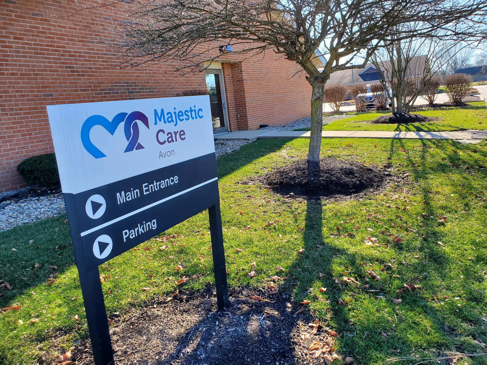 Exterior of Majestic Care Avon building with a large sign and landscaping.