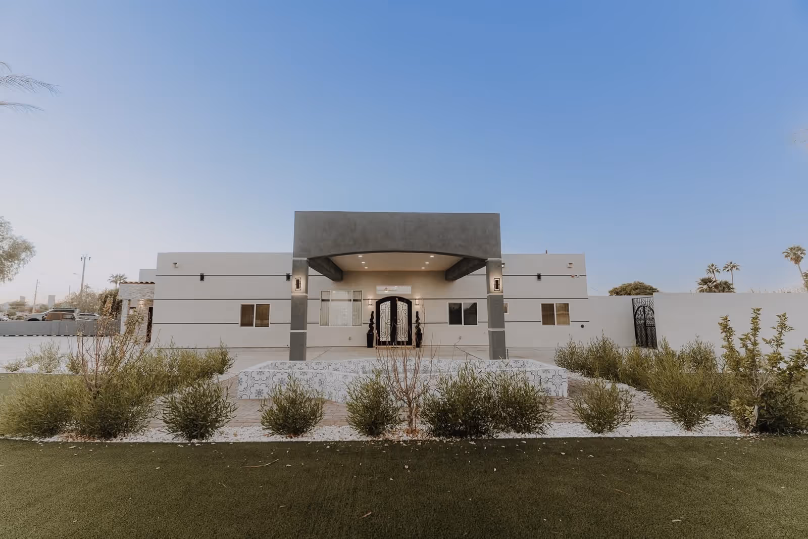 Modern single-story facility with a covered front entrance and desert landscaping.