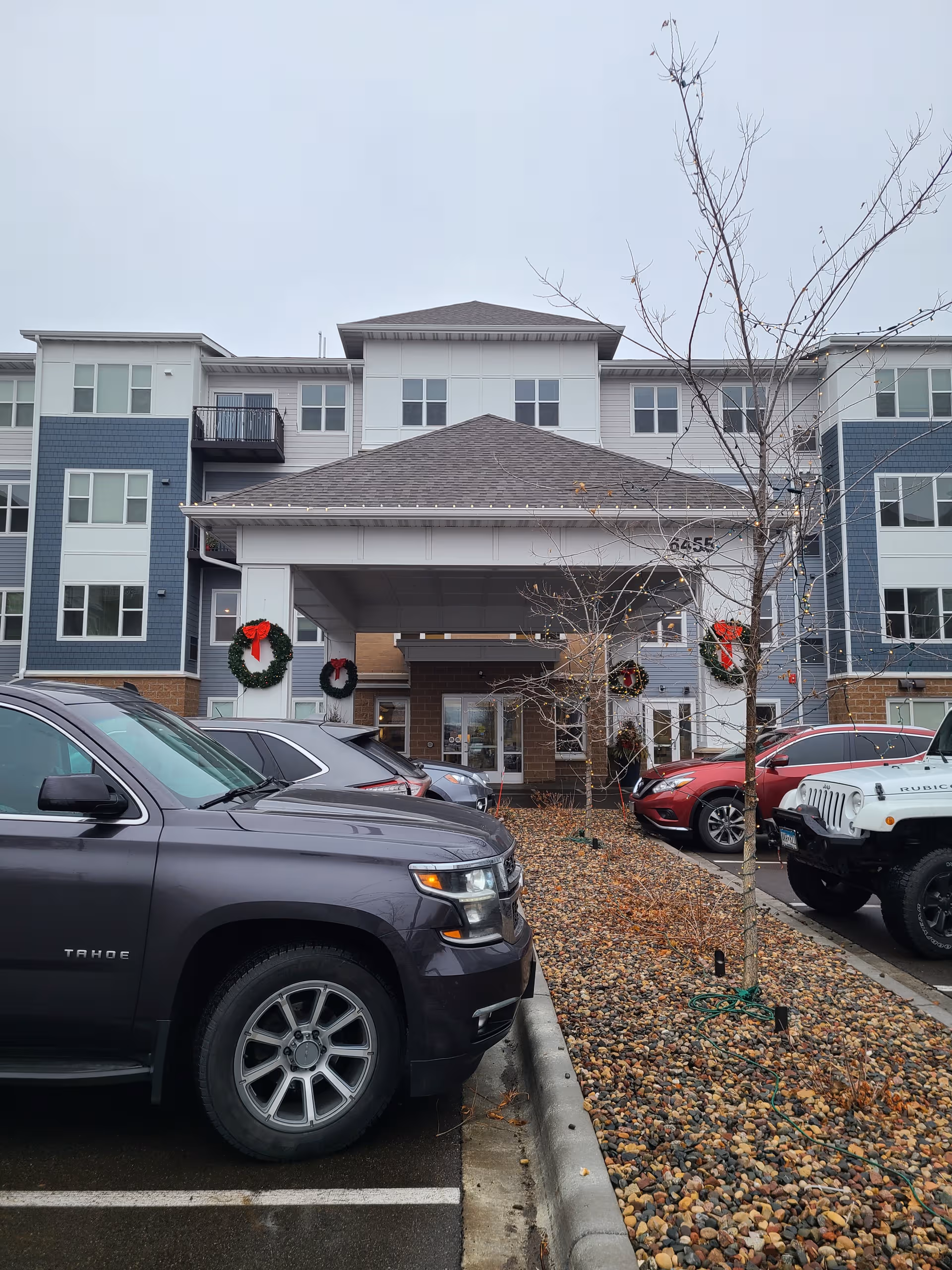 Front view of Willows Bend Senior Living building with wreaths at entrance