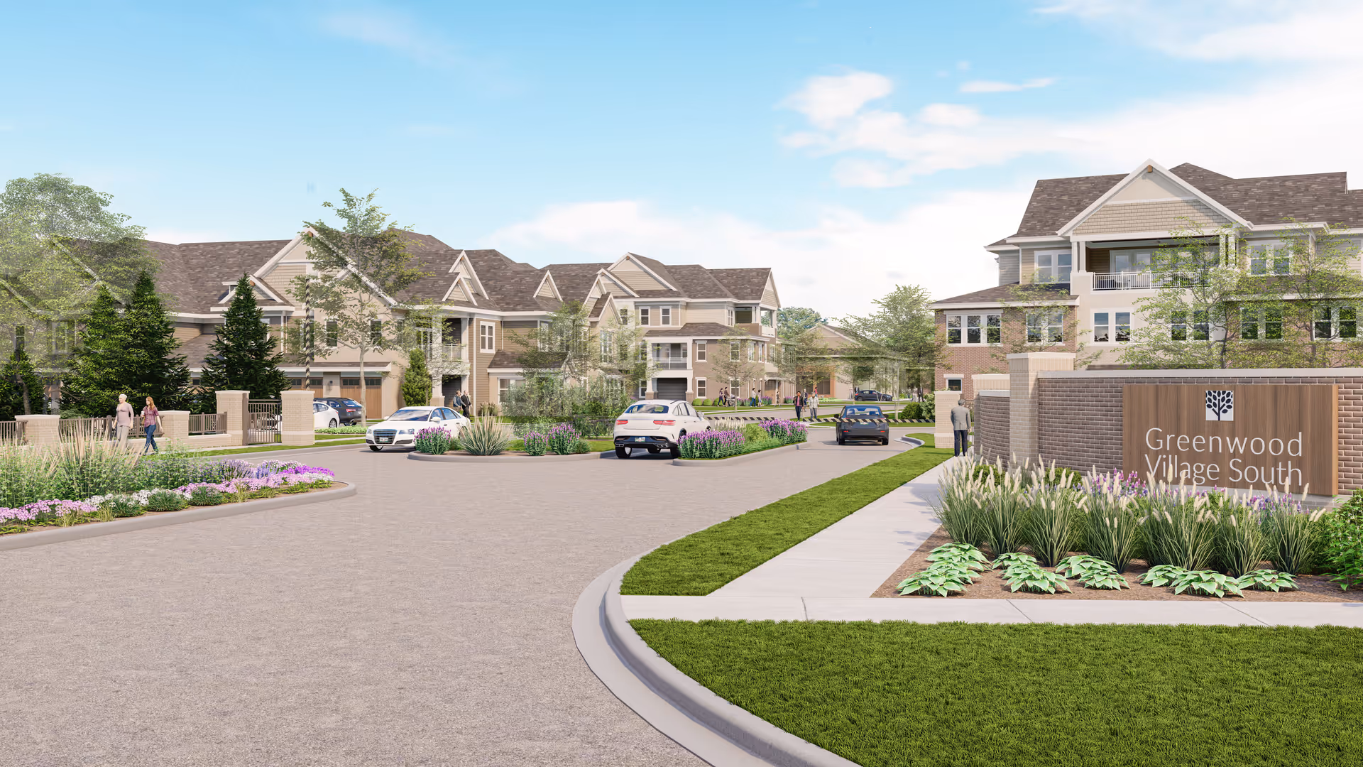 Entrance drive, landscaping, and multiple residential buildings of a senior living community with a sign reading "Greenwood Village South".