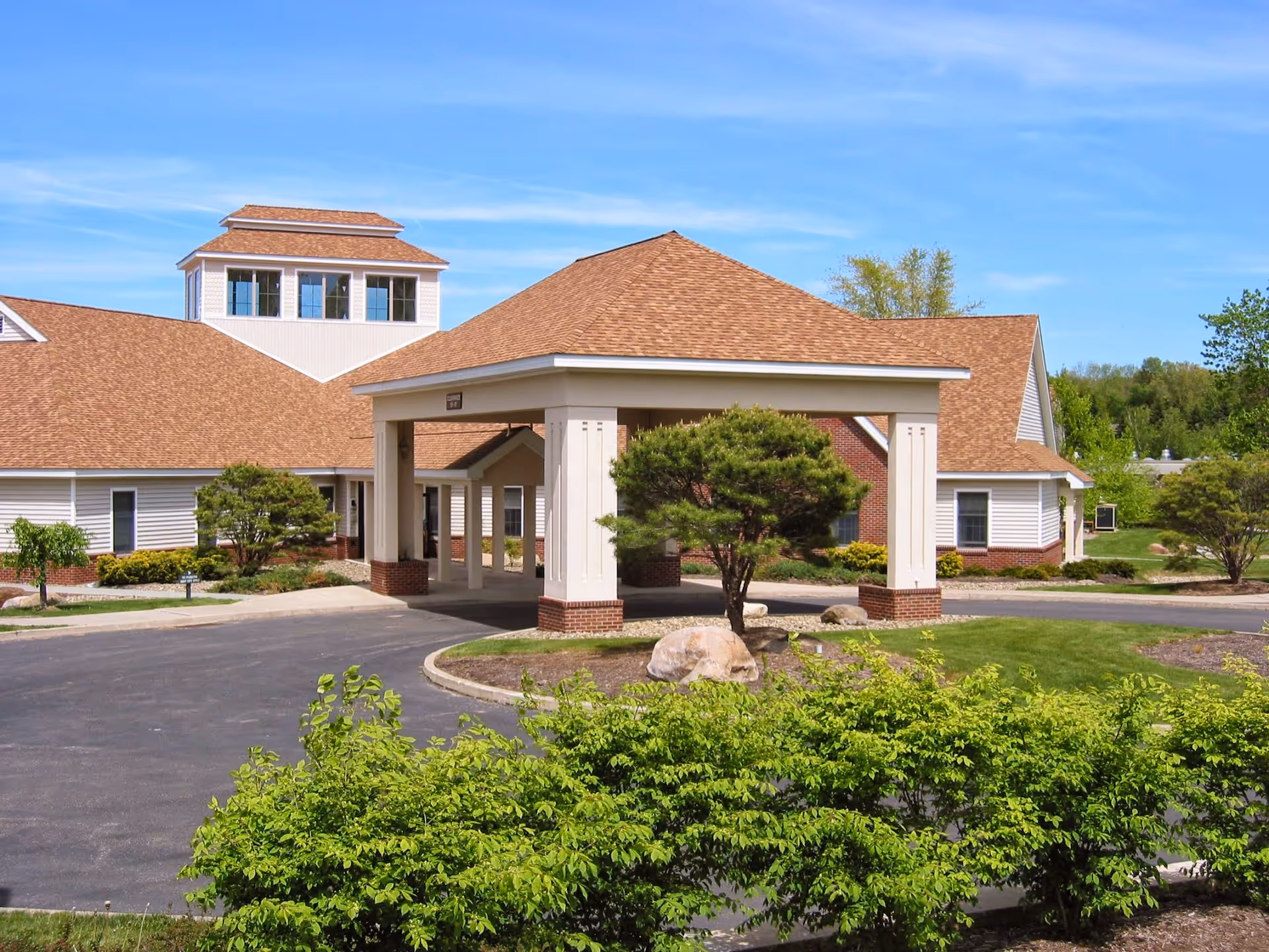 Wesbury United Methodist facility exterior with a covered entrance and manicured landscaping.