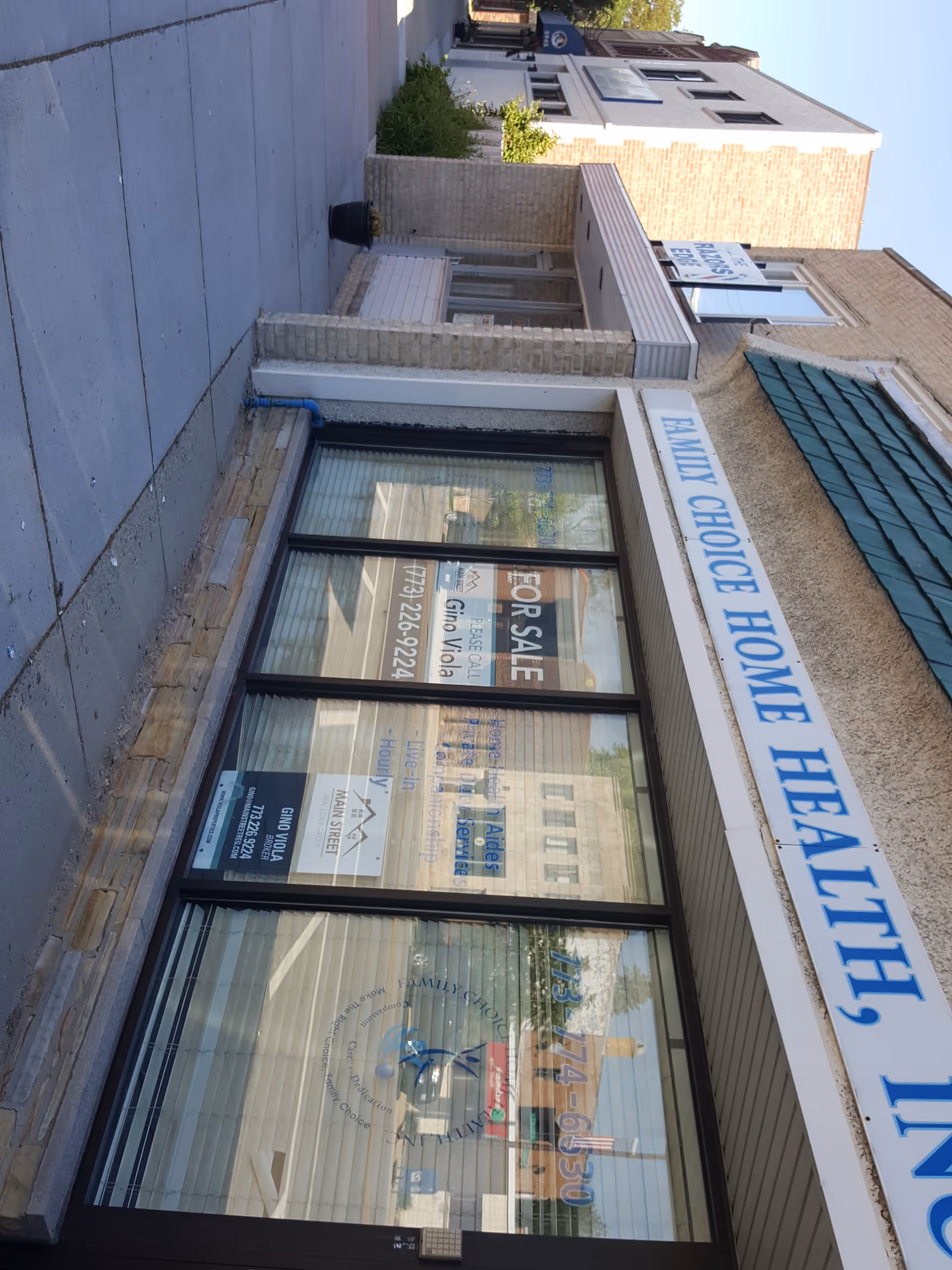 Front exterior of Family Choice Home Health Inc building with large glass windows.