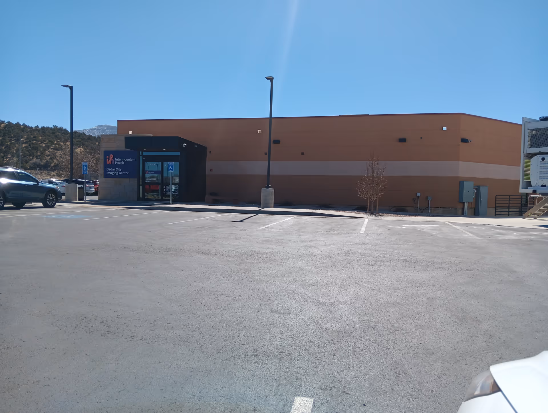 Exterior view of Intermountain Health Home Health Cedar City building with a parking lot.