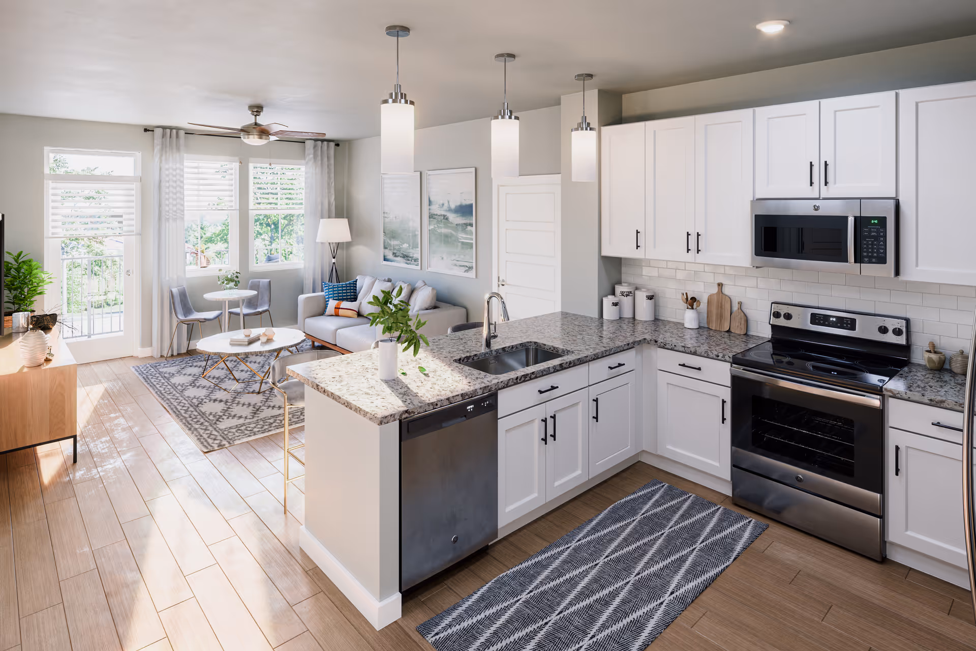 Bright open-concept kitchen and living area with white cabinets and stainless appliances.