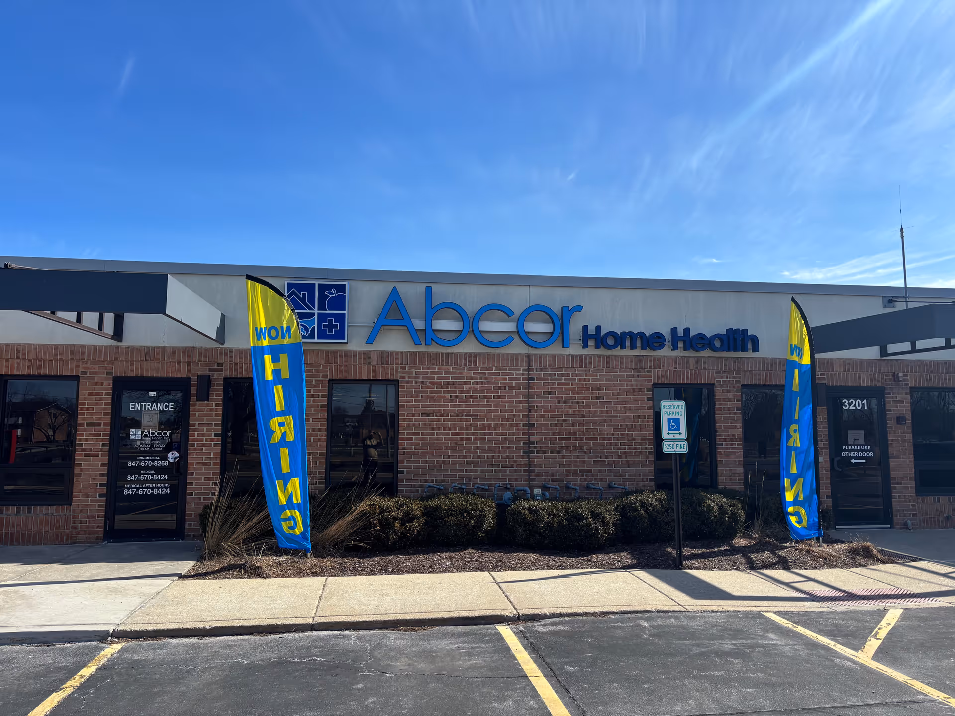 Front exterior view of Abcor Home Health building with blue logo signage.