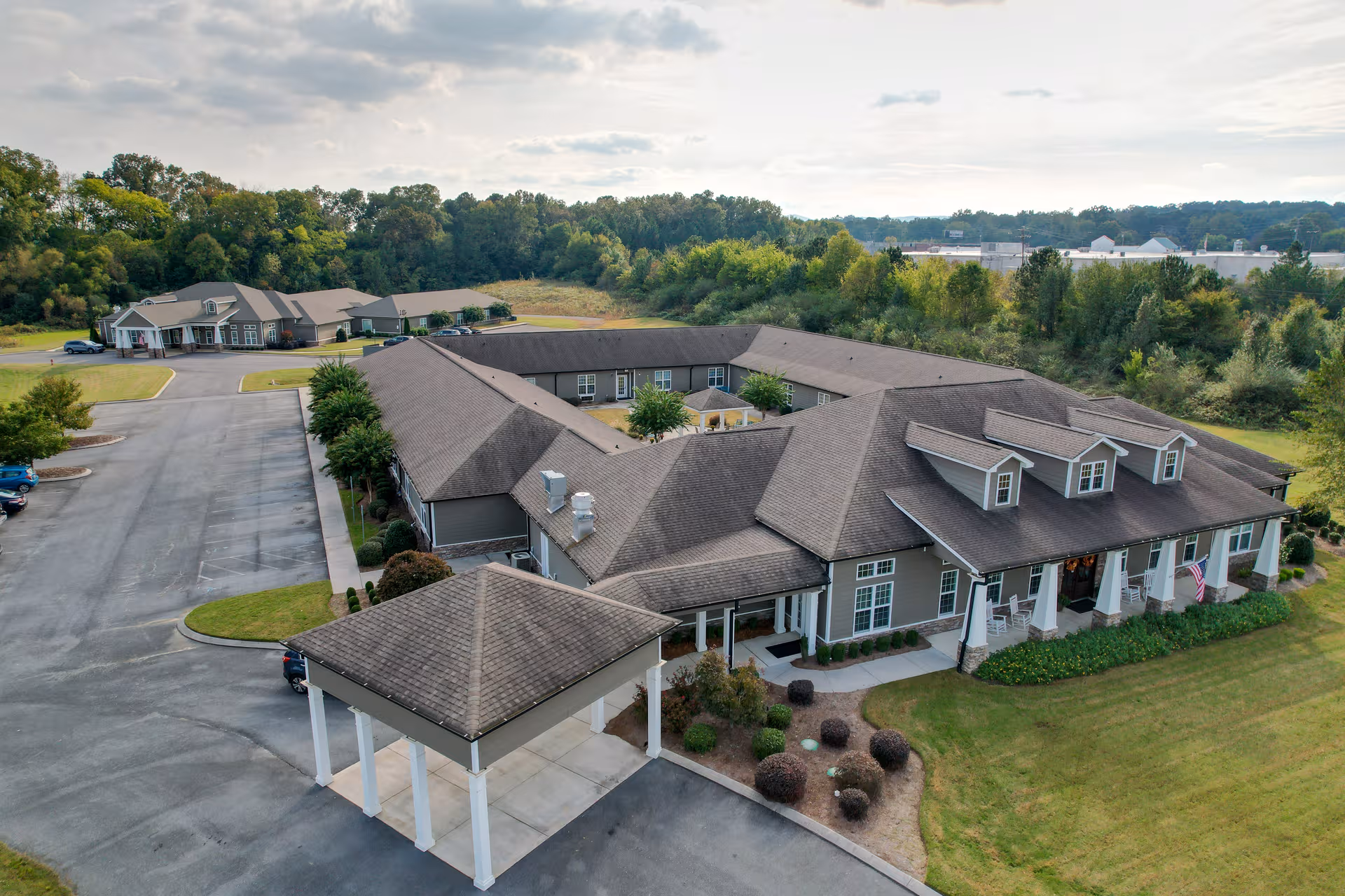 Aerial view of Orchard Ridge Residences, a multi-wing senior living campus with front entrance.